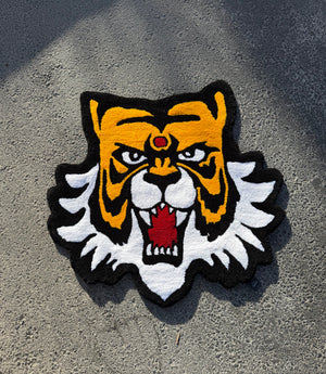 Masked Tiger tufted rug: hand-tufted tiger head rug in amber, black and white with a red gem, made in Amman, Jordan thumbnail 1