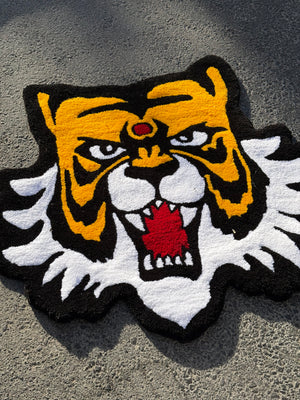 Shaped tiger head rug on asphalt, angled view of the hand-tufted Masked Tiger rug thumbnail 3